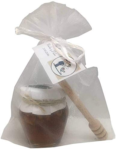 Detalle de tarro de miel con nueces acompañado de palito catador en bolsa de organza (Pack 24 ud)