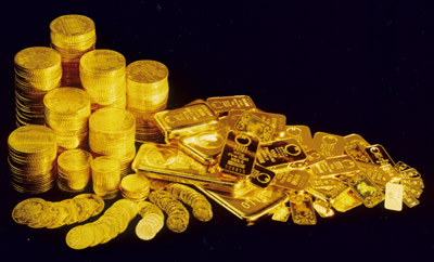 Monedas y lingotes de oro para la venta