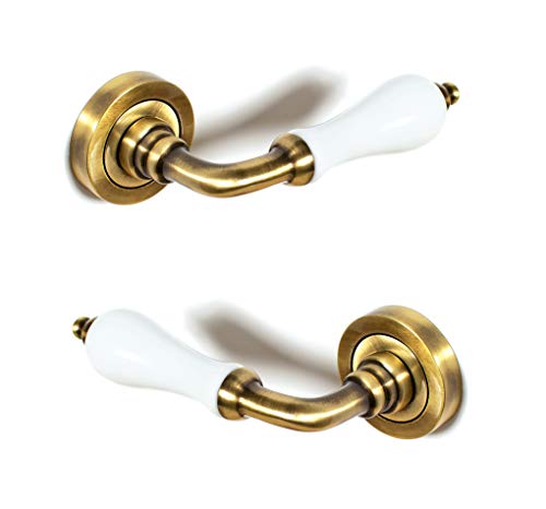 ARCO · Juego de manillas para puerta, acabado cuero satinado con porcelana blanca · Fabricado en España ARCO · Juego de manillas para puerta, acabado cuero satinado con porcelana blanca · Fabricado en España
