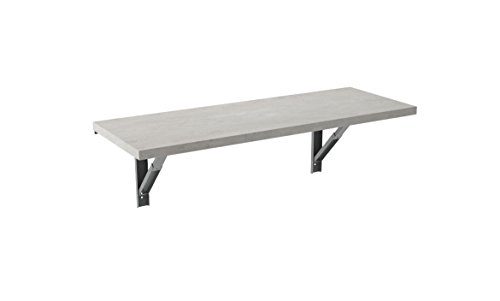 Mesa Vulcano plegable de pared con tablero de 115 x 42 cm de laminado de 32 mm de cemento realizada también a medida.